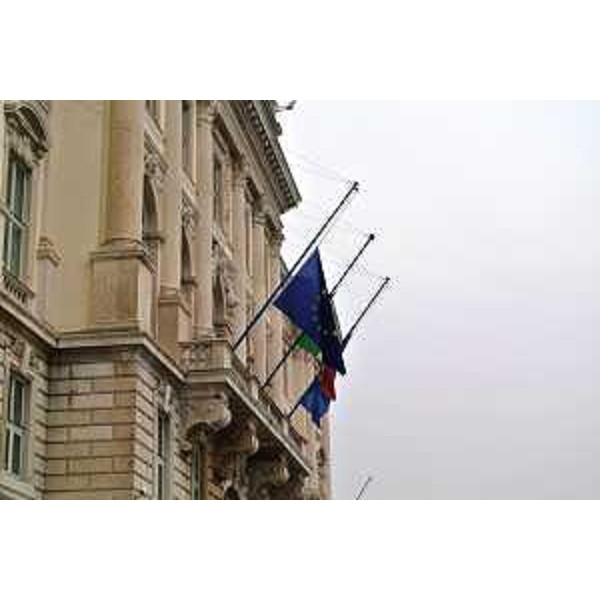 Il palazzo sede della Presidenza della Regione Autonoma Friuli Venezia Giulia, in piazza Unità d'Italia, con le bandiere a mezz'asta in segno di lutto per la strage del 7 scorso alla redazione del Charlie Hebdo a Parigi - Trieste 09/01/2015