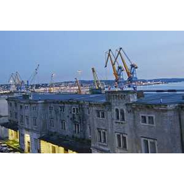 In primo piano, infrastrutture del Porto Vecchio; sullo sfondo la città e le infrastrutture del Porto Nuovo - Trieste 14/04/2016