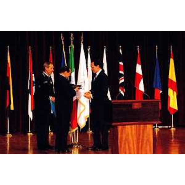 Luca Ciriani (Vicepresidente della Regione) con Silvio Berlusconi (Presidente del Consiglio) e Guido Bertolaso (capo della Protezione civile nazionale) mentre riceve la medaglia d'oro della Protezione Civile Nazionale. (L'Aquila, 09/11/2010)